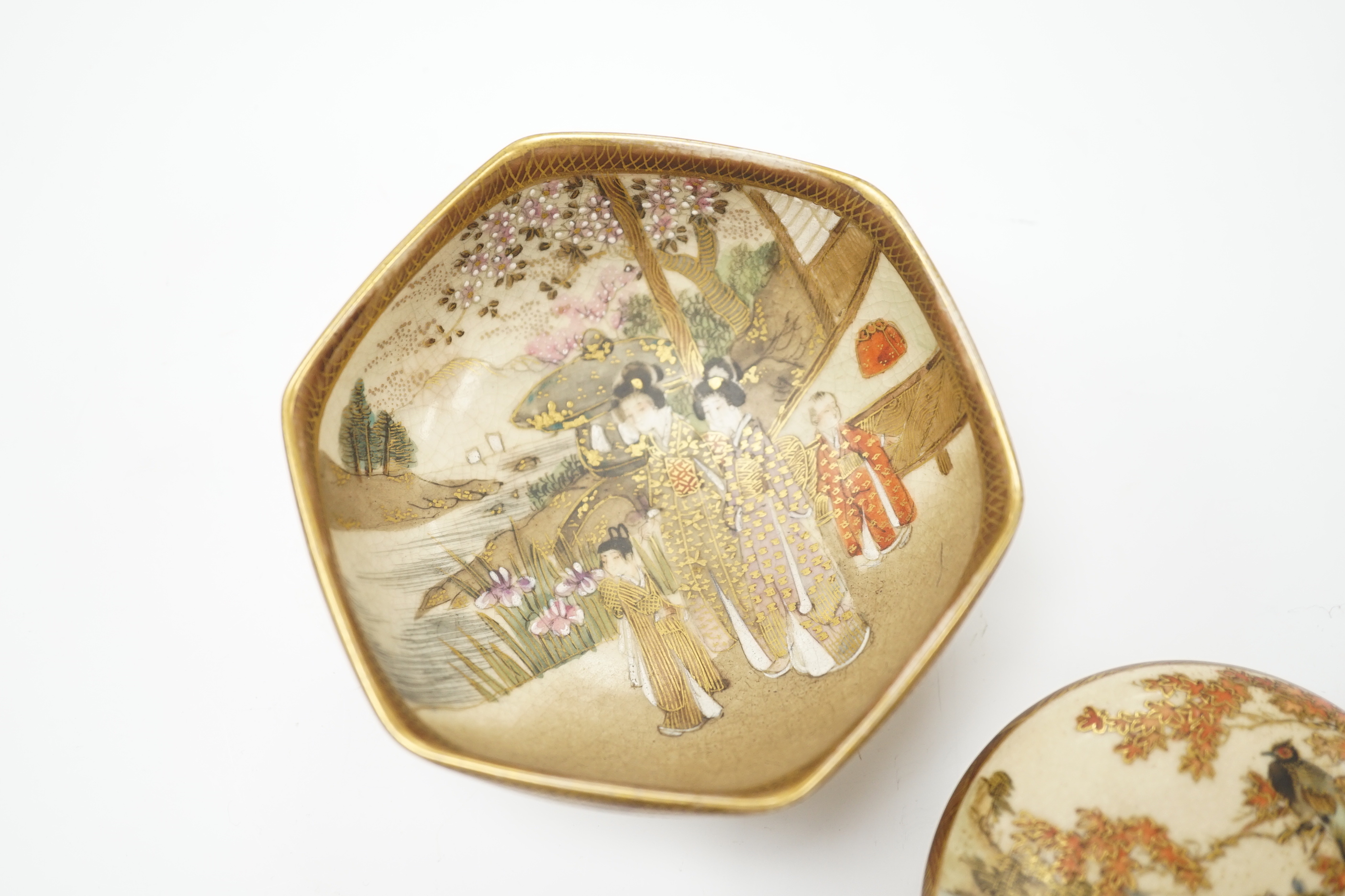 A Japanese Satsuma compressed box and hexagonal bowl decorated with figures, largest 9.5cm wide